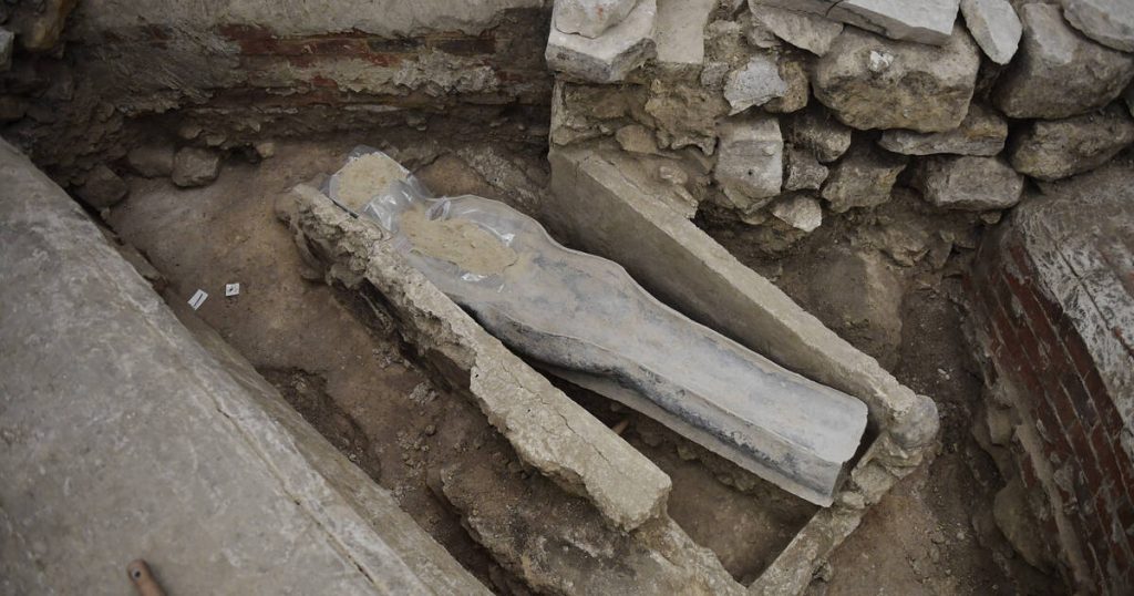 lead sarcophagus discovered in the floor of Notre Dame Cathedral, in Paris, (Photo by JULIEN DE ROSA / AFP)